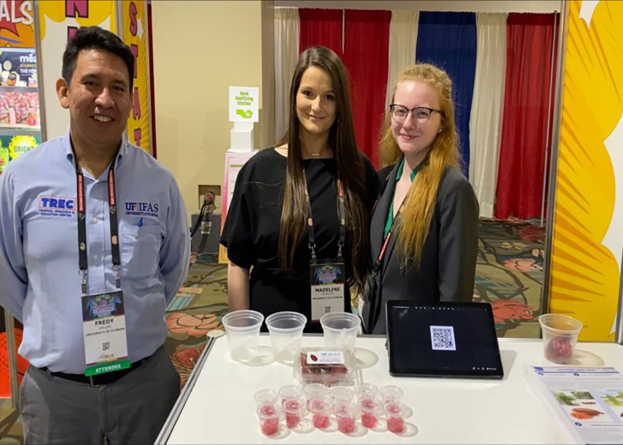 Group of people at booth with Finger Lime samples